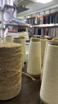 Colored cotton yarn cones in textile factory production
