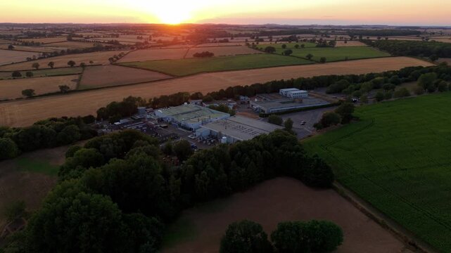 Aerial view of a rural science and technology park at golden sunset in Northamptonshire UK