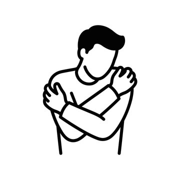 Person hugging themselves in a gesture of self comfort and care.