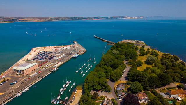 Aerial view of Weymouth harbour and the historic Nothe Fort surrounded by the blue waters of Weymouth Bay on the Dorset coast, Weymouth, Dorset, United Kingdom.
