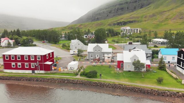 Summer aerial view of Seydisfjordur waterfront and valley.