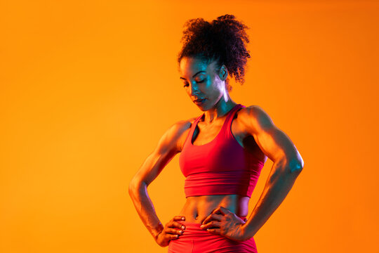 Sportive black hispanic woman wearing sportswear training