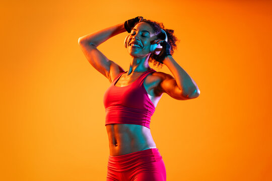 Sportive black hispanic woman wearing sportswear training