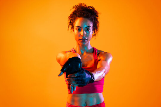 Sportive black hispanic woman wearing sportswear training