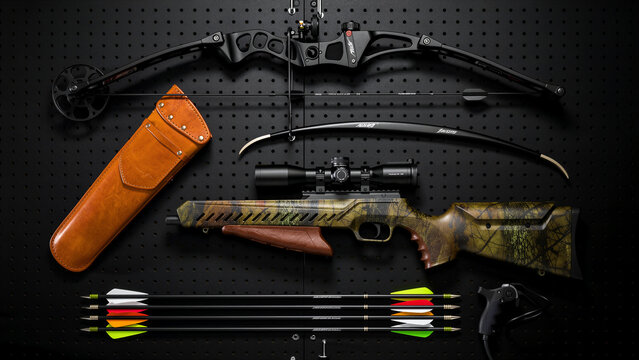 Compound bow and camouflage rifle with hunting gear on a black pegboard. Professional display of outdoor sports equipment including quiver and arrows. Hunting hobby and gear storage concept.