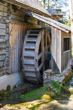 wooden wheel of an old watermill near ramsau in austria, europe