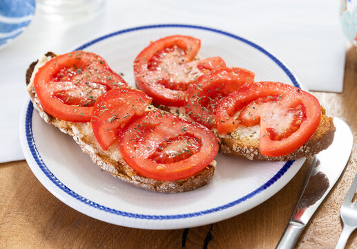 delicious bruschetta with fresh tomatoes on ciabatta slices on a plate