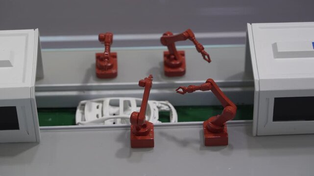 model of robotic and automation welders arms weld the car part on factory on manufacture of the Assembly line
