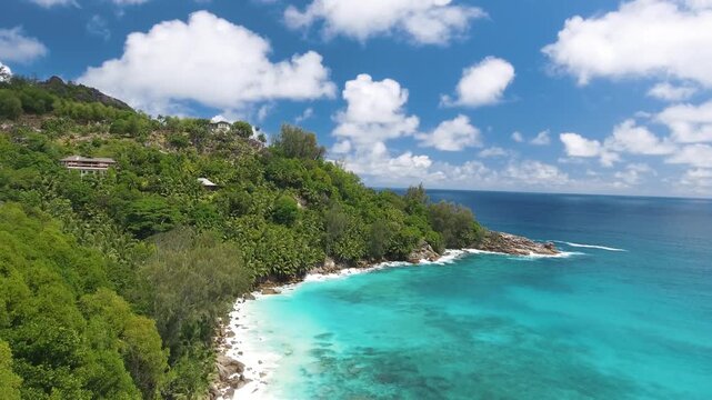 Vacation travel holidays and recreation on beach concept. Tropical beach with sea and palm taken from drone. Praslin island, Seychelles