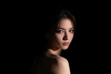 Fototapeta premium Theatrical Spotlight Lit Artistic Woman Portrait