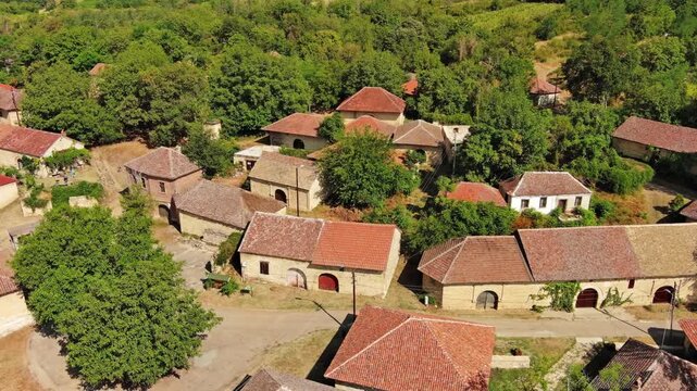Aerial around view of old rustic vintage houses with wine cellars in Rogljevacke pivnice in Negotin region of Serbia, 4k