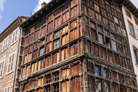 Macon, France: Famous 15th century Maison de Bois half timbered wooden house with carved figures and medieval architecture.