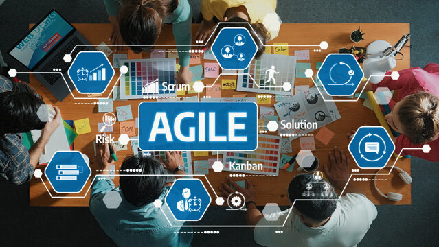 Engaging workspace showcasing a team utilizing Agile methodology, featuring charts, post-its, and visual tools to enhance collaboration and streamline project management processes. Amity
