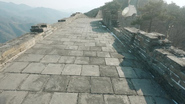 Stone-Paved Walkway and Weathered Ramparts Along a Mountain Ridge of