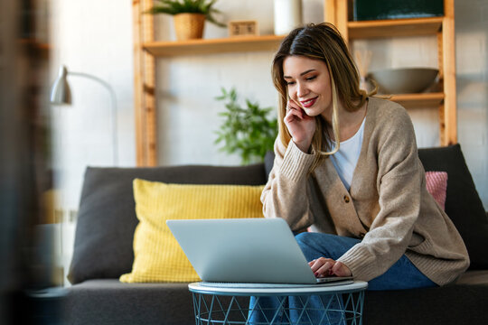 Technology remote job, lifestyle concept. Success woman with laptop computer working at home office