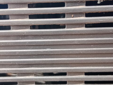 Close-Up Abstract Texture of Metal with Horizontal Slats and Industrial Surface Detail