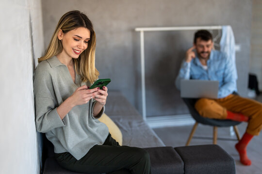 Woman enjoys digital lifestyle at home, using smartphone for online connection, mobile communication