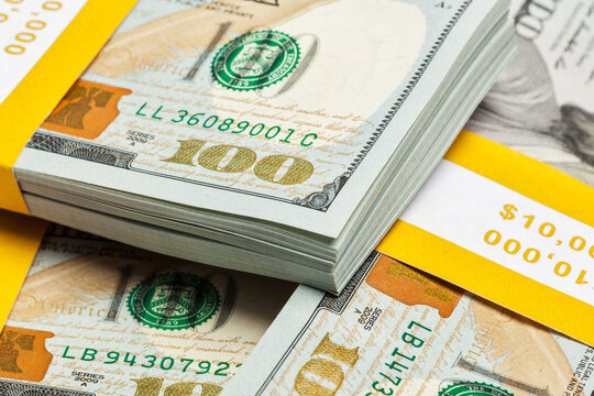 Scene featuring creative business finance making money concept - background of of new 100 US dollars 2013 edition banknotes bills bundles close up