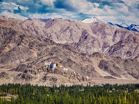 Vintage retro effect filtered hipster style view of Thiksey gompa alongside Himalayas. Ladakh, Jammu and Kashmir, India