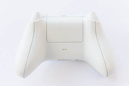 Rear view of a modern white wireless video game controller