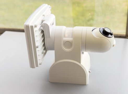White Outdoor Security Camera and Light with Motion Sensor