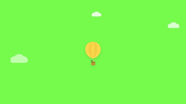 Yellow hot air balloon floating above a green sky