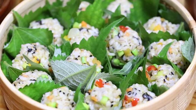 Korea barley rice ball jumeokbap barley grain perilla leaf making rice balls hand hands cooking preparation Korea 한국 보리밥 주먹밥 보리쌀 깻잎 쌈주먹밥 손 만들기 조리과정 주방 식재료 한식 전통음식