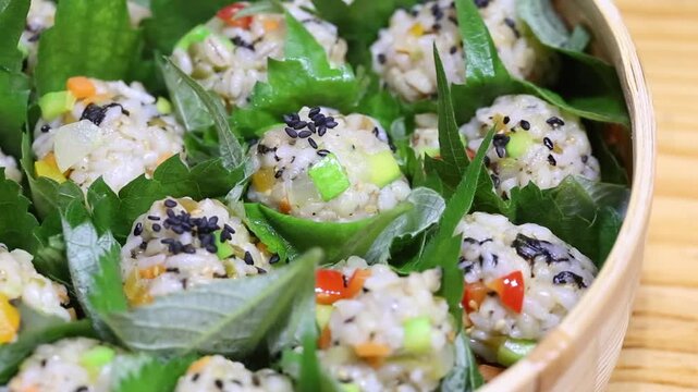 Korea barley rice ball jumeokbap barley grain perilla leaf making rice balls hand hands cooking preparation Korea 한국 보리밥 주먹밥 보리쌀 깻잎 쌈주먹밥 손 만들기 조리과정 주방 식재료 한식 전통음식