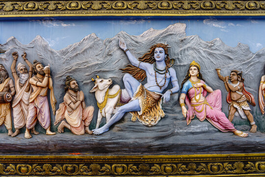 India. Uttarakhand. Haridwar. A bas-relief depicting the god Shiva and his wife Parvati seated in the Himalayan mountains
