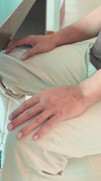 elderly asian man hand with unilateral parkinsonian tremor, parkinson's disease on one side during single side early stage of neurological disorder symptom, vertical video