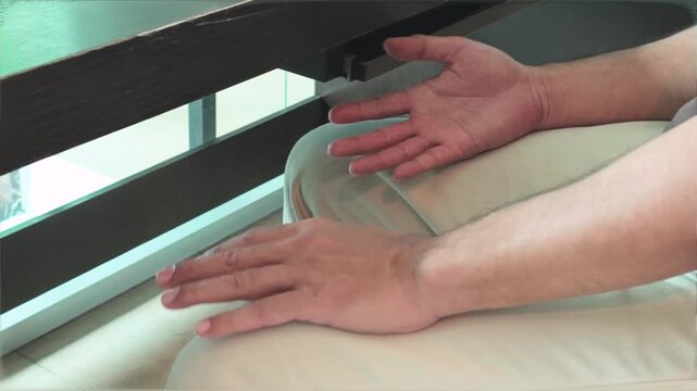 elderly asian man both hands shaking with bilateral parkinsonian tremor, parkinson's disease on two sides during the progressing stage of neurological disorder symptom
