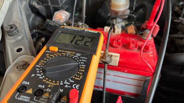 Car Battery Voltage Test with Digital Multimeter 12.2V