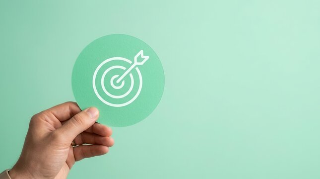 Success concept of 2026 new year vision with a hand holding a green target paper cut.