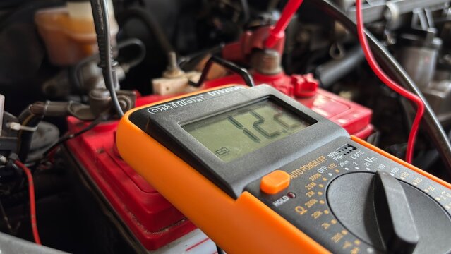 Car Battery Voltage Test with Digital Multimeter 12.2V