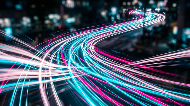 Long exposure photography of vibrant city traffic light trails moving along a busy highway at night in urban environment
