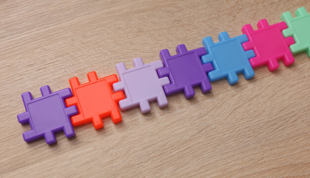 Plastic children's construction puzzle on the table