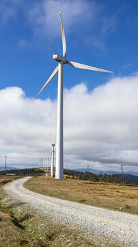Large wind turbine on a rural mountain path