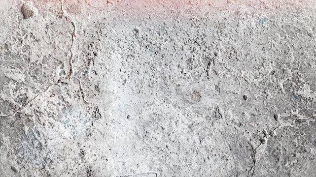 Seamless 4K looping vertical movement across a rough light concrete surface with natural grain and weathered texture. Perfect for architectural backgrounds and overlays.