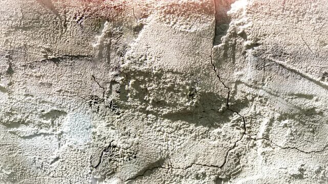 Seamless 4K looping vertical movement over a rough plaster wall with handcrafted texture and natural relief. Great for artistic backgrounds and architectural design.