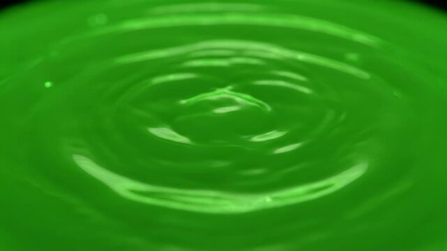 Vibrant abstract green liquid splash, fluid motion, dynamic energy, mesmerizing ripple, ethereal smoky vortex, glowing, birth of something new, magical beginning, calm, wonder, captivating