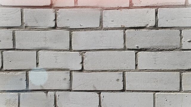 Seamless 4K looping vertical movement across a painted gray brick wall with clean geometric masonry pattern. Perfect for architectural backgrounds construction projects and urban motion graphics.