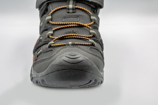 Mens black sporty trekking sandals active footwear closeup on white.