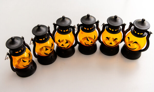 Six Glowing Halloween JackoLantern Miniatures on White Background
