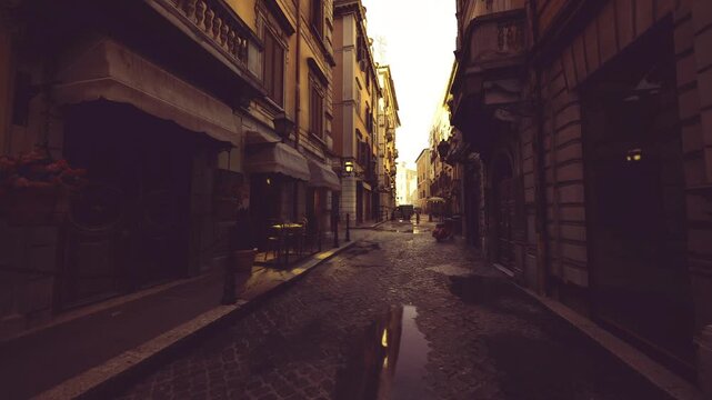 narrow historic passage at dusk framed by tall facades, wet cobbles and deep shadows, moody texture and strong leading lines for editorial storytelling