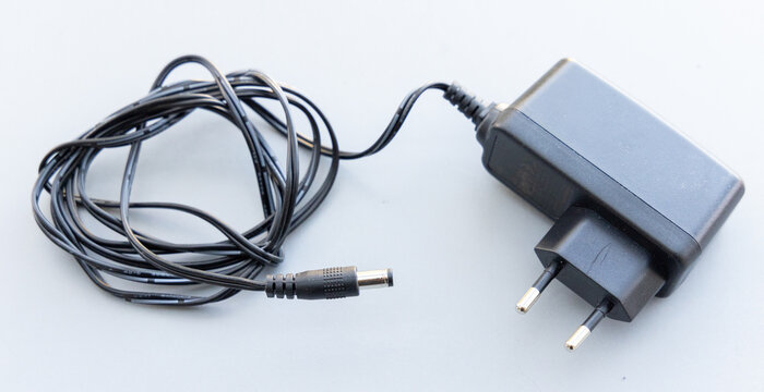 Black AC Power Adapter with Coiled Cable and Barrel Connector