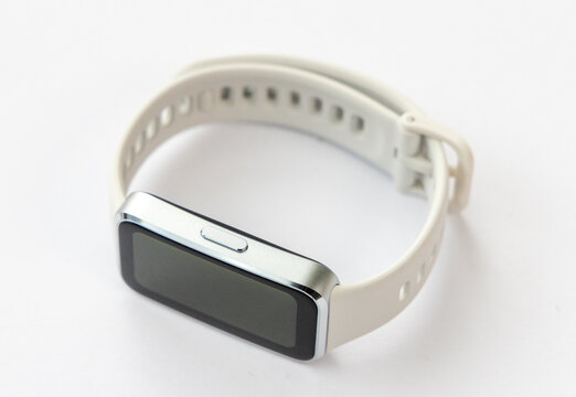 A Modern Smartwatch with a Light Strap on a White Background