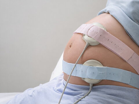 Close-Up of Fetal Monitoring Sensors on Pregnant Belly