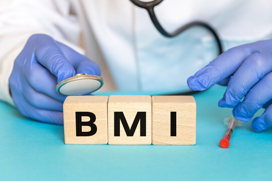  BMI symbol. Medical concept of weight management and obesity diagnosis. Doctor with stethoscope over wooden blocks with acronym BMI.