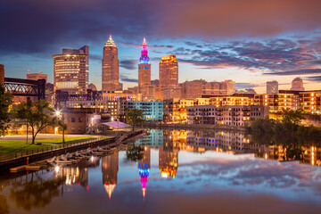 Obraz na płótnie Canvas Cleveland, Ohio, USA. Cityscape image of Cleveland, Ohio with reflection of the city skyline in the water at beautiful sunrise.