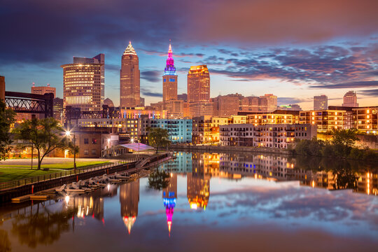 Cleveland, Ohio, USA. Cityscape image of Cleveland, Ohio with reflection of the city skyline in the water at beautiful sunrise.